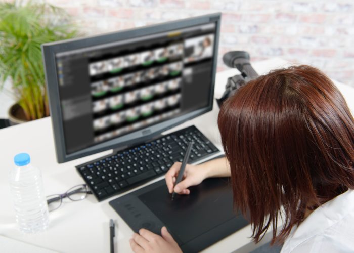 young female designer using graphics tablet young female designer using graphics tablet for video editing